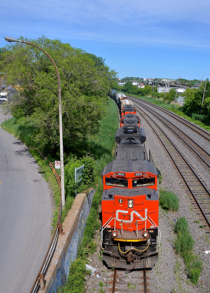 Head on on the transfer track. CN 527 has an SD70M-2 leading a pair of GP9's (CN 8935, CN 4140 & CN 7224) as it heads west towards Taschereau Yard on the transfer track.