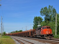 <b>A solo SD40-2W on a rail train.</b> CN 5346 is the sole power on CN 486, a loaded rail train bound for Edmunston, NB that is passing through St-Lambert. At the tail end of the train is mixed freight.