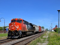 CN 377 with 188 cars total is passing through Dorval station with two AC units (CN 2869 & CN 8101 mid-train). He would not make it far as a bad order car would require a setoff at Coteau.