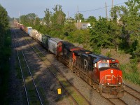 CN 323 is back from St. Albans, VT with IC 2698 & CN 2601 as he approaces Taschereau Yard on a sunny evening.