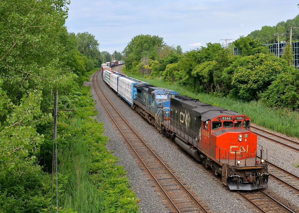 CN X324 has a great lashup composed of CN 5266 and IC 2460 as he heads towards St. Albans and interchange with the NECR.
