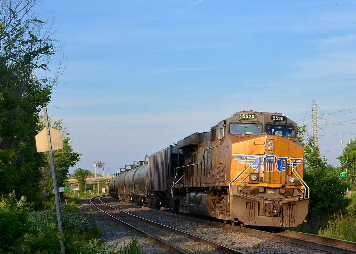 UP in Montreal. UP 5520 is the DPU at the tail end of CP 550, with CEFX 1051 at the head end. This crude oil train is passing through Pointe-Claire and is on its way to Albany, NY.