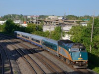 <b>A new VIA train.</b> VIA 669 is a new train which departs Montreal's Central Station at 1830 for Toronto. Here it passes through Montreal West with VIA 6432 leading 4 LRC cars.