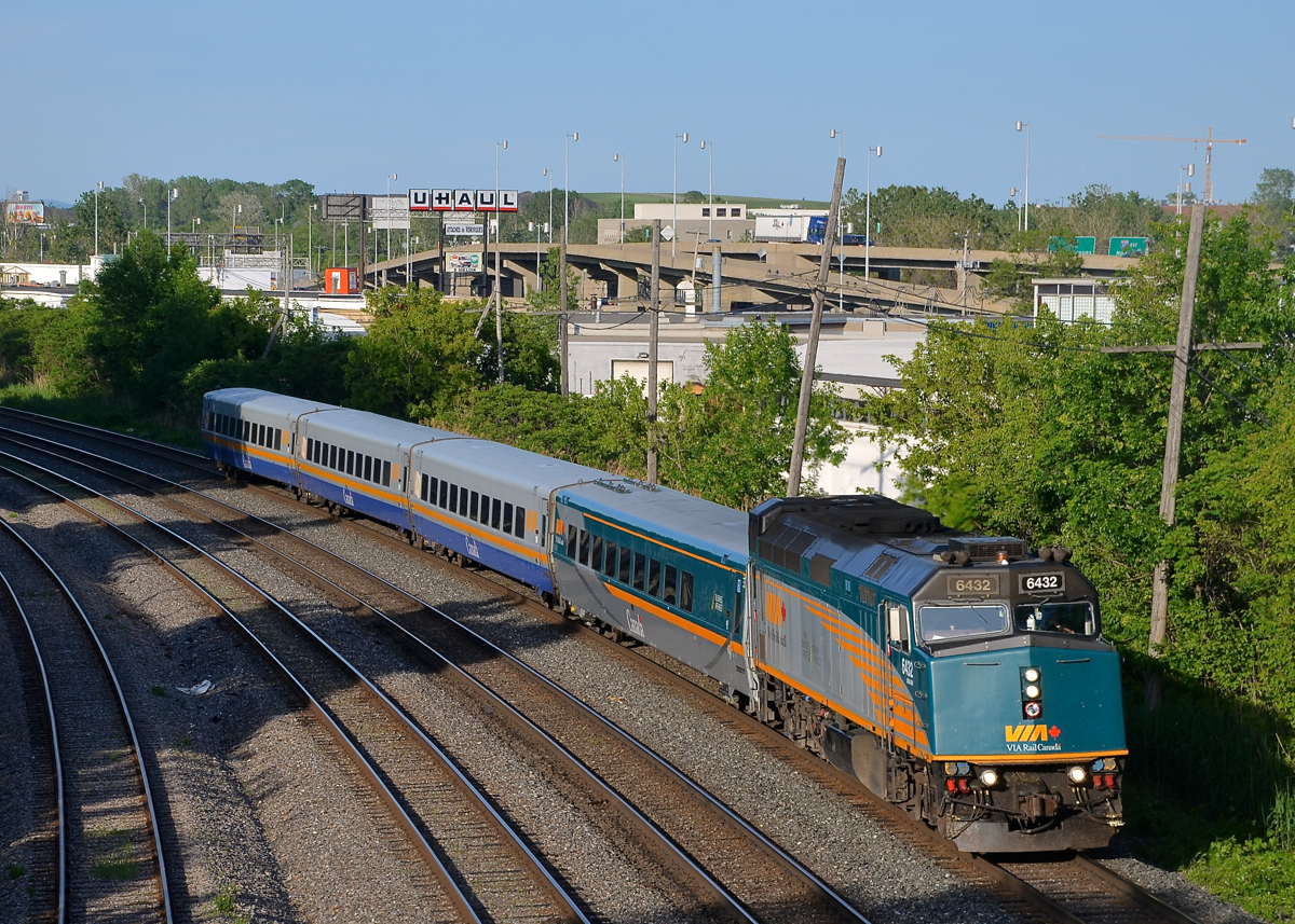 A new VIA trian. VIA 669 is a new train which departs Montreal's Central Station at 1830 for Toronto. Here it passes through Montreal West with VIA 6432 leading 4 LRC cars.