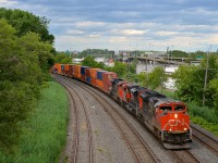 A trio of SD70M-2's (CN 8939, CN 8859 & CN 8819) lead CN 121 through Montreal West as the skies threaten to open up.