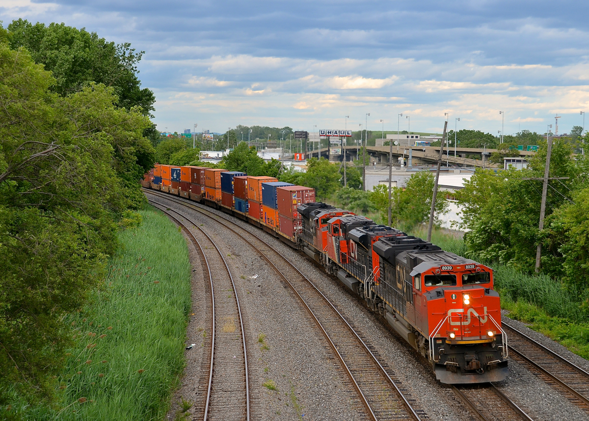 A trio of SD70M-2's (CN 8939, CN 8859 & CN 8819) lead CN 121 through Montreal West as the skies threaten to open up.