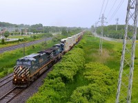 <b>Back to back BC Rail in the rain.</b> I got up to this overpass in the pouring rain after chasing CN 149 with just a couple of seconds to change my settings and then get a quick wide shot. Worth getting wet for my first solid set of BC Rail units! CN 149 is seen roaring through Pointe-Claire with BCOL 4646 & BCOL 4651 for power.