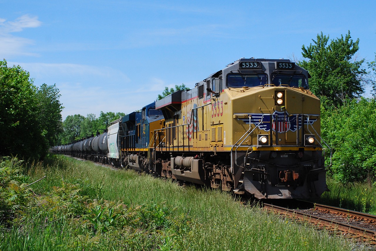 CP 646 with UP 5533 and CSXT 3024 is having no trouble climbing the Niagara Escarpment approaching Quigley Road.  It looks like the engineer is enjoying all the attention his train got today.  Thanks to all that posted updates on FPON.