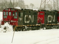 Here is a photo of a pair of 7100's working the Geco Spur in Scarborough.  This was a nasty January day, likely 1992.  They were servicing the GM Van plant on Eglinton Ave, and it closed in 1993. I have another frame showing these locos alongside a 1200RS, so there was quite a lot of traffic in those days.  But now the tracks are gone, the locos are gone and the picture was shot from the parking lot of Warden Woods, a newly opened shopping mall, but today it has gone too.