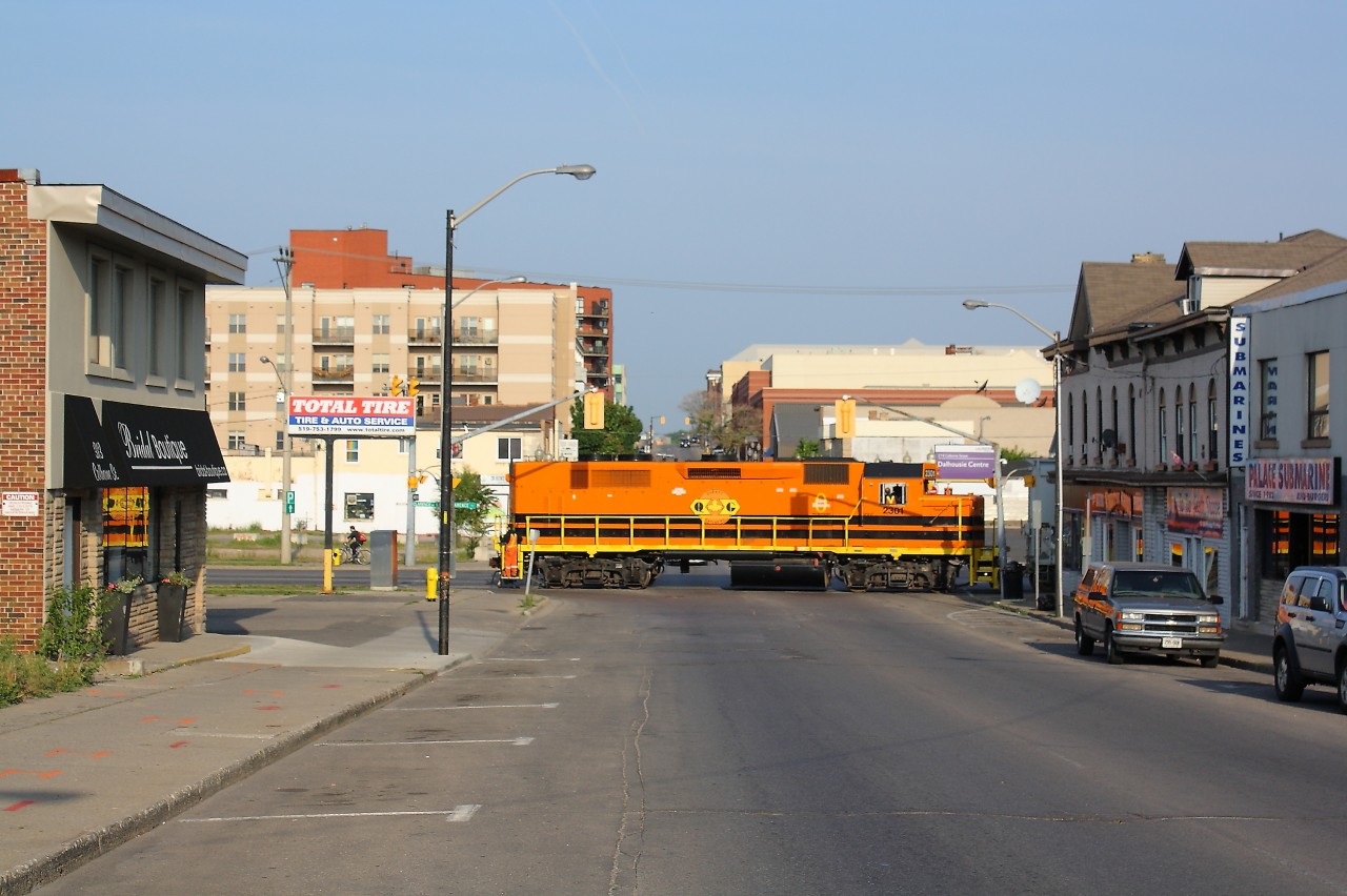 SOR 496 is lead through downtown Brantford by QGRY 2301.  They are seen crossing Colborne Street on their way to Ingenia, This was a nice catch before heading into work on a sunny Friday morning.