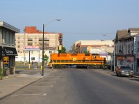 SOR 496 is lead through downtown Brantford by QGRY 2301.  They are seen crossing Colborne Street on their way to Ingenia, This was a nice catch before heading into work on a sunny Friday morning.