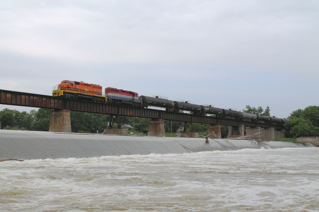 After spending my morning at Bayview Junction and the annual Bayview Meet, I had to get back to Caledonia for another commitment.  While in town I heard the horn of SOR 595 heading to Brantford, so I worked out the run time to Brantford and back and set up my shot down by the dam.  Pictured is RLHH 3403 and RLK 4057 leading train 595 across the Grand River in Caledonia on their way back to Nanticoke with about 18 tank cars.