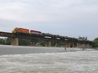 After spending my morning at Bayview Junction and the annual Bayview Meet, I had to get back to Caledonia for another commitment.  While in town I heard the horn of SOR 595 heading to Brantford, so I worked out the run time to Brantford and back and set up my shot down by the dam.  Pictured is RLHH 3403 and RLK 4057 leading train 595 across the Grand River in Caledonia on their way back to Nanticoke with about 18 tank cars.