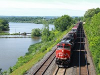 CN A42231, a daily Fort Erie to Toronto manifest rolls by the 21st annual railfan meet-up at CN's Bayview Junction with a variety of General Electric products for power.