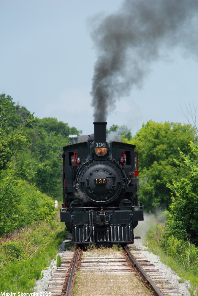 Former Canadian Pacific steam 136, being built in 1914 making it over a century old, is now owned by the South Simcoe Heritage Railway and is seen here charging northbound (going backwards in this photo) towards Beeton, Ontario where it'll head back to Tottenham Station and finish its excursion. This line, was built to connect 4 lakes, Ontario, Simcoe, Georgian Bay, and Huron. Now, all the line is gone except this small portion between Tottenham and Beeton where this heritage railway operates. Due to the heritage railway being non-profit, abilities for advertising are limited and not many tourists know about the railways existence, making it a good opportunity to go and see this steamer in operation.