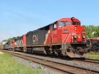 The "Buttermilk Express" if you believe the graffiti on the fuel tank of 2429 leading CN 5555 and GT 5831 on a slow moving mixed freight.