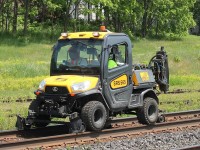 Sperry were scanning the siding at Woodstock station with what can only be described as the smallest HiRail  {Their Description} that I have ever seen. It is rapidly reversing to clear off the main at Wilson Street.