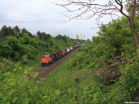 A westbound 3 locomotive manifest train ducks under the Hilda Ave overpass as the surrounding trees shine green. Sometimes I find it hard to believe we're already in June of 2015!  