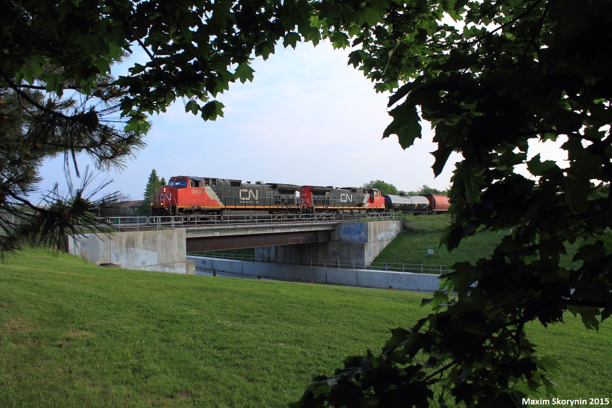 The daily Toronto-Joffre eastbound manifest passes over the New Westminster Drive bridge shot from Gilmore Park. As the sun sets, I took the opportunity to get decent framing rather than just shooting the train straight on which I've done probably hundreds of times at this location.
