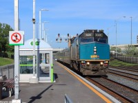 VIA 76, a Toronto - Sarnia passenger train approaches the newly established Etobicoke North GO Station on the north side of the tracks. The station used to stand on the south side of the tracks, and the old station depot still stands with dust covering. With the opening of the Union Pearson Express, which opened the day of the photograph, the station had to be transferred over to the north side of the tracks since the UPX would use the 2 south tracks, as the spur to the destination to Pearson Airport is about a mile down the tracks and crossing over with plenty of GO Trains and other rail transport will be quite challenging and will cause plenty of delays.