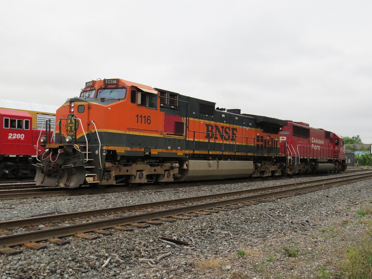 CP 147 prepares to switch London yard to lift one autorack. Minutes later the police were called to inspect the train for a rider.