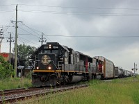 CN 330 effortlessly rips over the Louth Street crossing in St. Catharines with a Death Star in the lead. Trailing is CN 5795, and a short train in tow. 330 is making good time, passing through a little before 6pm.