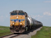 Foreign power on a branch line. UP 5501 is making the 30 mile trip to Pecten, Alberta with liquid gas tank cars in tow. This was my first time following a train down this line. After a rather dull day railfanning on the Crowsnest Sub, I heard the RTC give clearance for this train to Pecten. I arrived at Brocket just as it was leaving the mainline. This was much more exciting than waiting hours with nothing in Crownest Pass. 