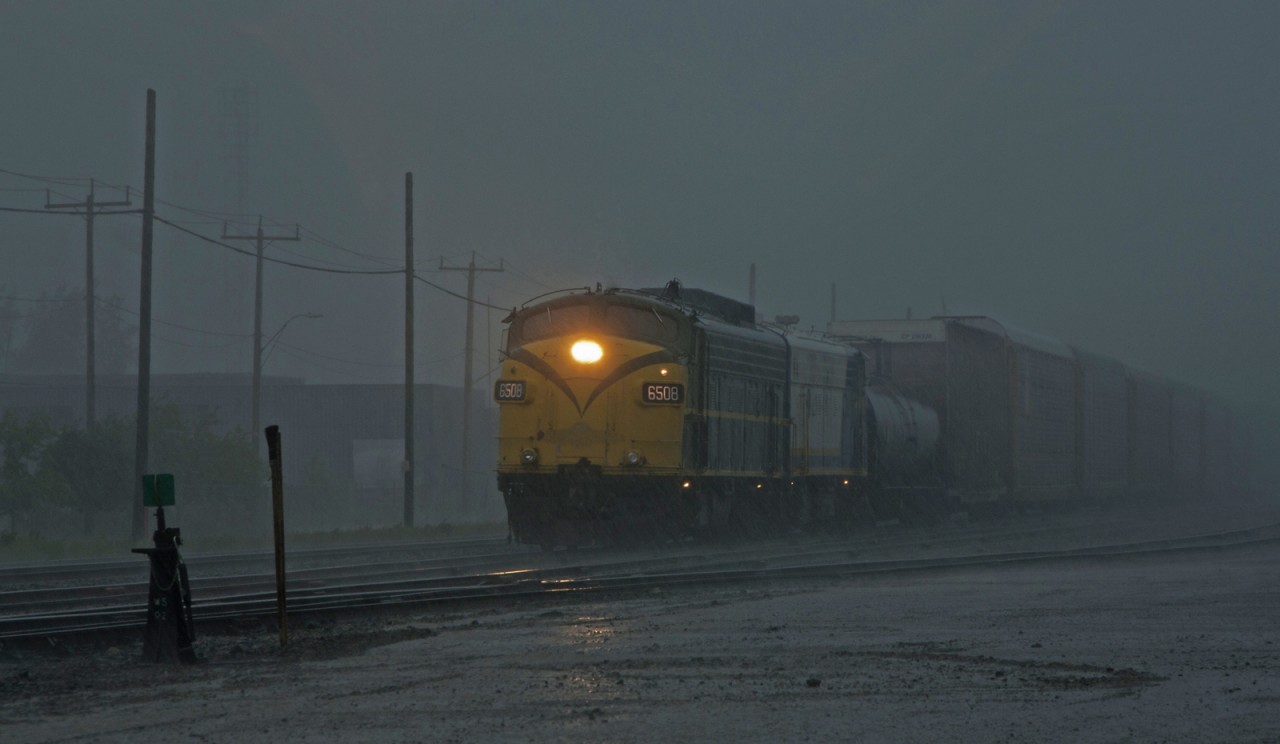OSR FP9A's #6508 and #1401 switch the yard at Woodstock during a torrential downpour.