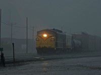 OSR FP9A's #6508 and #1401 switch the yard at Woodstock during a torrential downpour.