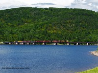 OVR - LLPX 2221 & LLPX 2241 pulls a short string of cars across the Ottawa River as they head to Temiskaming yard.