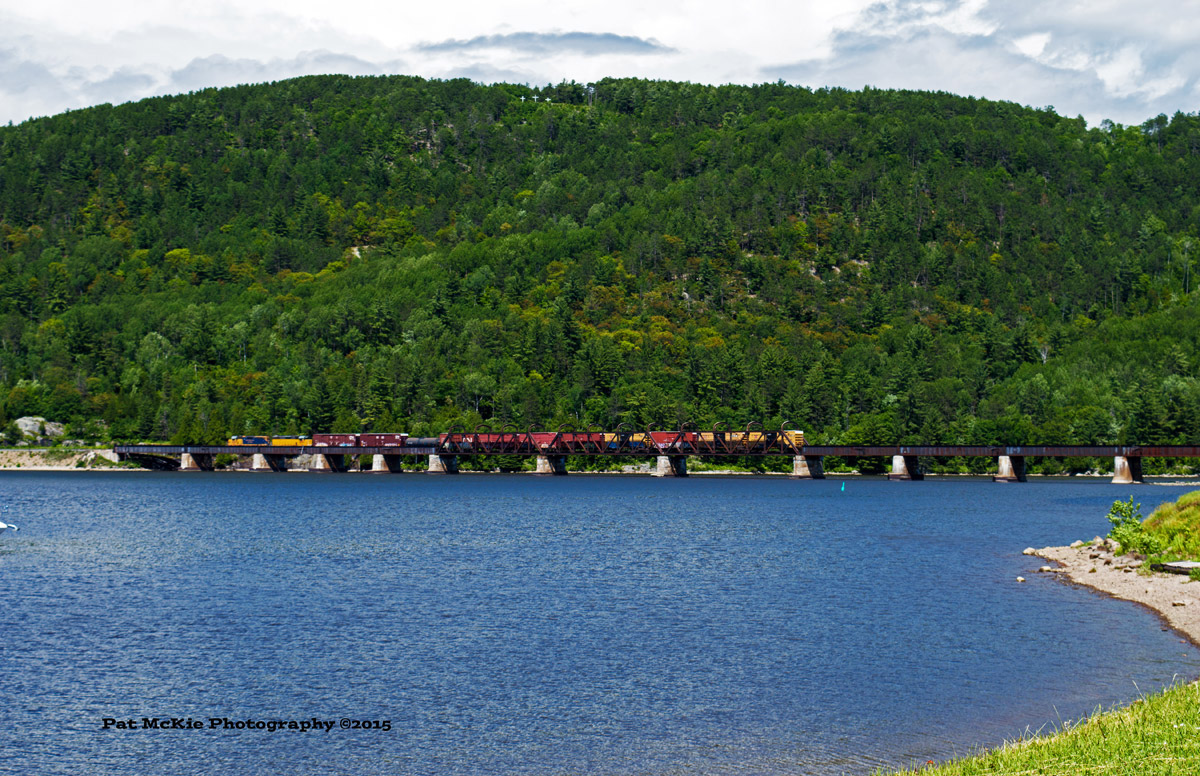 OVR - LLPX 2221 & LLPX 2241  pulls a short string of cars across the Ottawa River as they head to Temiskaming yard.