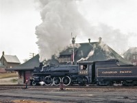 On a very gloomy day, the late Del Rosamond found Pacific-type #1227 passing the Pembroke station.  

This is an extremely rare view of this long-gone landmark.
