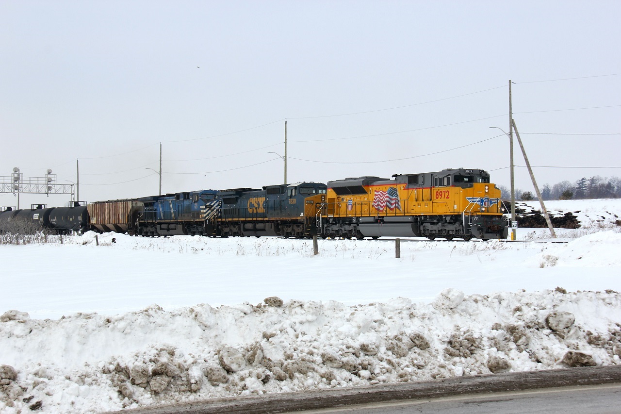 An eastbound ethanol train glides eastward on the Galt Sub with a nice power set, including UP 8972 leading CSXT 7830 and CEFX 1051.