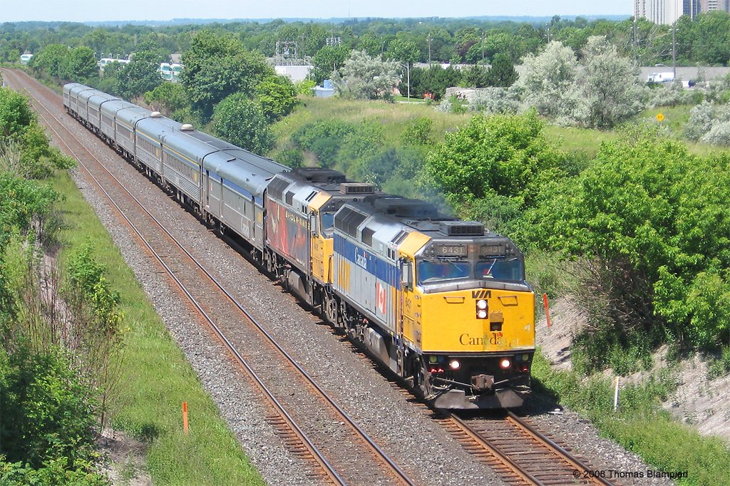 VIA 6431 leads Spiderman unit 6408 with an unusually long train 60 on a hot summer day.