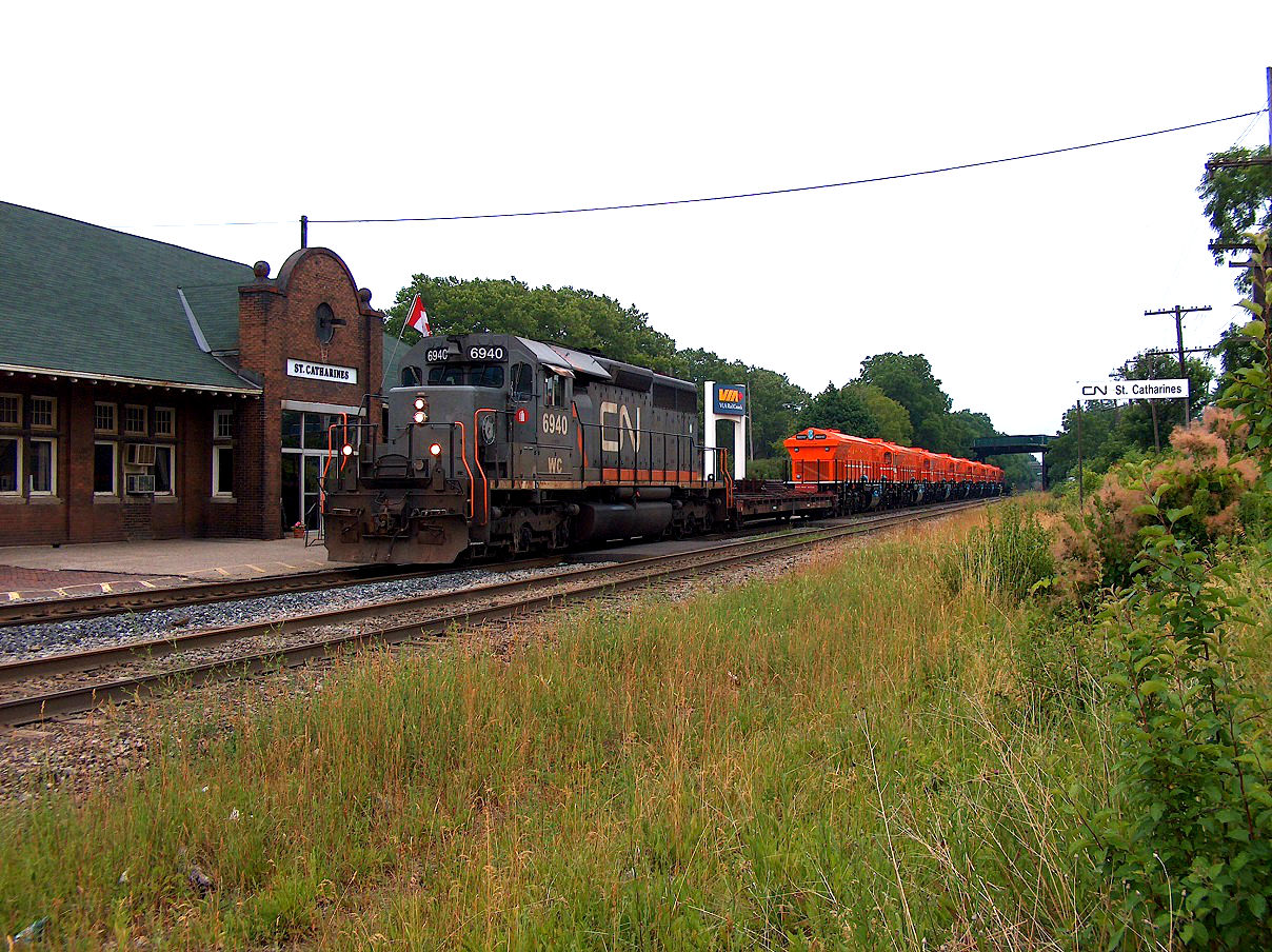 Back on July 4, 2007, I had to go to St. Catharines for traffic control training for my job at the time. So why not try and do a bit of foaming while in the area? On this particular day, an export unit train was out. Here we see train X436 going by the St. Catharines VIA station with WC 6940 and a string of export locomotives for Algeria. Note, these CN grey with orange stripe locomotives were kicking around back in 2006-2007; not sure what happened to them.