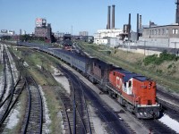 In the early days of VIA, the power was not painted as fast at the coaches.  At least that was my impression as a couple of times a year visitor.  Here's an example with 2 rebuilt RS18's pulling a Tempo train (probably from Windsor) through Bathurst St on September 4, 1978. Even with not visiting Toronto for several years, I know how much this has changed.