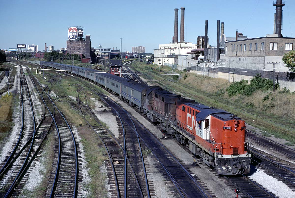 In the early days of VIA, the power was not painted as fast at the coaches.  At least that was my impression as a couple of times a year visitor.  Here's an example with 2 rebuilt RS18's pulling a Tempo train (probably from Windsor) through Bathurst St on September 4, 1978. Even with not visiting Toronto for several years, I know how much this has changed.
