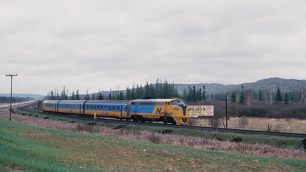 ...and in the mid eighties the thought was that the weekly 44 passenger  *   trains serving CN Washago was minimal service...ha...wrong... 


Here is Saturday only ONR conventional train #120 ( Northlander equipped) on the approach to Huntsville ( or ? ) with converted FP7A #1987 ( the former green & yellow #1510).


That is the two lane highway #11 at left ( now Regional road #592 ? ), prior to the four lane divided highway.


...And from what I remember Granma Lee's was a neat place...


  *  those weekly 44 trains at Washago: 14 VIA #9 & #10 ( Toronto section Canadian); 14 ONR – VIA pool trains #128 & #129 Northland; 12  ONR #121 & #122 Northlander and ONR weekend trains #120, #123, #124 ( shown on the Timetable as conventional, but Northlander equipped).


May 21, 1983 Kodachrome by S.Danko.