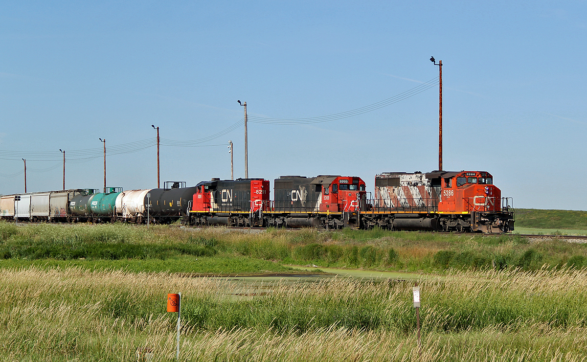 A pair of CN SD40-2(W)'s, 5291 & 5286, bracket ex UP SD40-2 5369 switching at the east end of CN's Scotford Yard.
