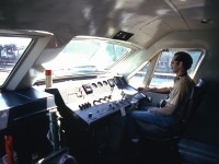 A rare look inside the cab of Bombardier's LRC demonstrator locomotive JV1, while at CN's station in Sarnia ON in May of 1975. Posed inside is my railfan friend Ken Borg, trying out the right-hand seat and then-modern engineer's controls. <br><br> Taken while the BBD demo LRC JV1 and coach JV2 were test-running on CN Tempo trains in the Toronto-Sarnia corridor, a view of the sleek modern exterior can be found here: <a href="http://www.railpictures.ca/?attachment_id=19855"><b>http://www.railpictures.ca/?attachment_id=19855</b></a>.