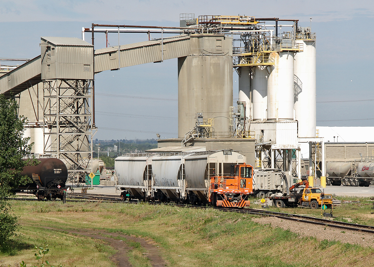 After CN has droped off fresh cars at the Lafarge plant in Clover Bar, Lafarge's own car mover proceeds to organise them  as required.