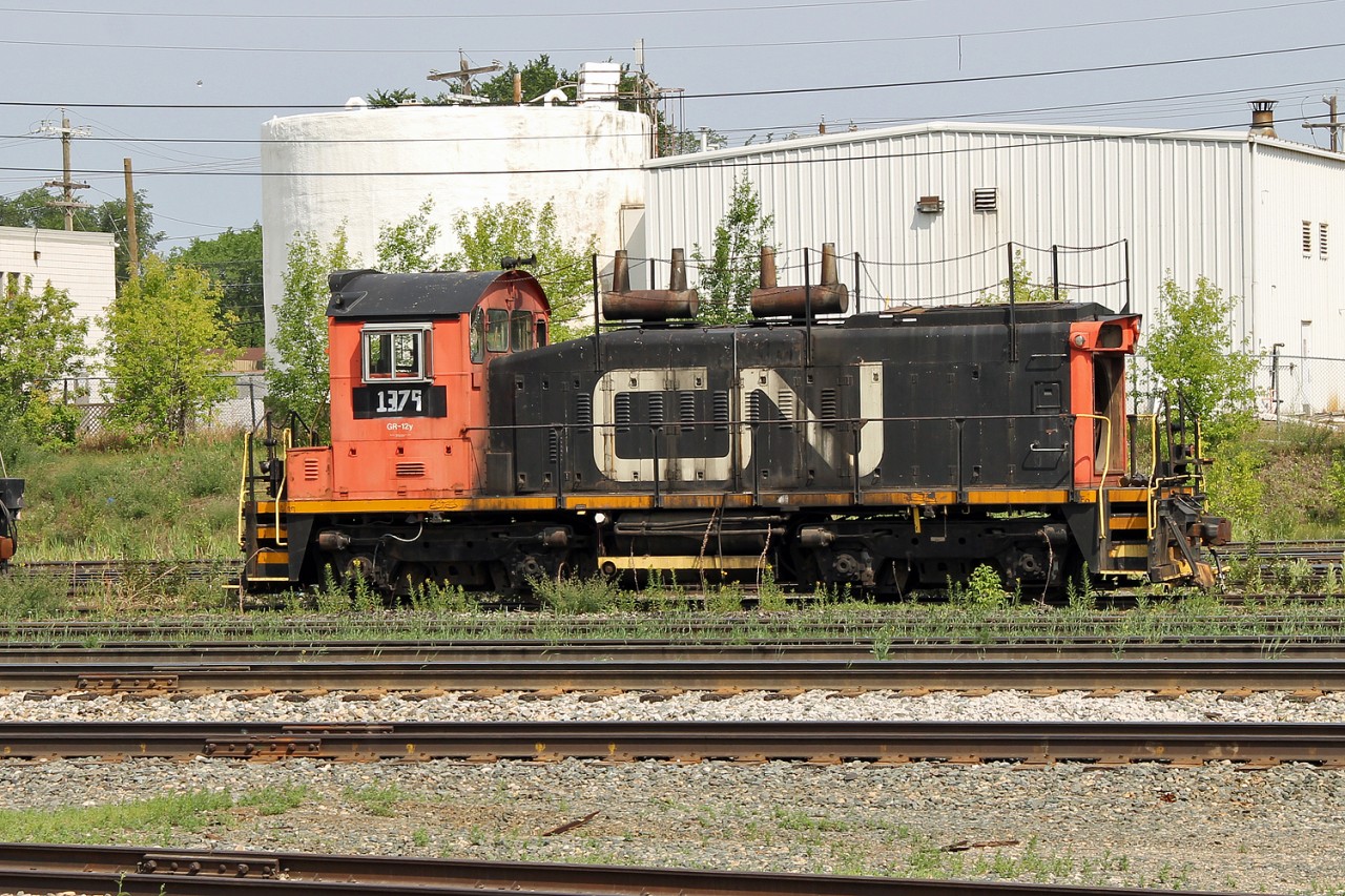 CN SW1200RS 1379 at CN's Walker Yard. Originally retired in 1999 and then renumbered CS02 and used as a shop switcher.  She now looks like she is permanently retired and waiting permanent disposal.