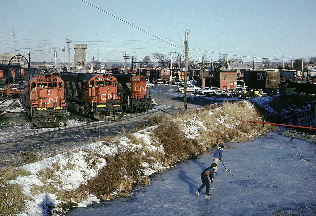 A lot has changed since I took this picture. Of course the MLWs are gone and try skating on CN property these days! The fuel tank is no longer there nor the containment pond and kids don't use tube skates any more!