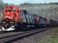 The likes of these beasts we shall never see again on Canadian mainline service, and we are all so much poorer for it........Lead unit MLW M-636 #2310, looking good in her relatively new paint, ended up on the Arkansas & Missouri Rwy; and trailing MLW C-630M #2002 I believe was scrapped. This view was captured just before the westbound move passed the old Dundas station. The clamouring of these majestic units as they climbed the 9 mile grade along this route was unforgettable. I can still hear them:o)