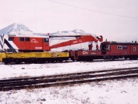 CN 50397 Industrial Brownhoist 250 ton wrecker, s/n 12368 built in 1957. It was originally assigned to the GTW in Battle Creek, MI. according to a July 1960 CN crane roster. It sits here in the cold snow covered Kamloops Yard in January of 2003 nearing the end of its useful life at CN.