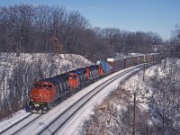 CN GP40-2W 9533 leads another GP40-2W and an MLW with a westbound approaching Bayview. The load in the head end is a set of airplane wings from McDonnell-Douglas plant at Downsview.