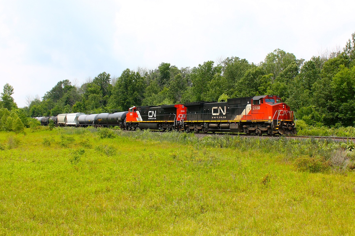 CN 330 highballs down the Strathroy Subdivison still in the early portion of its journey to Port Robsinson Ontario seen here at Sexton Road just West of Kerwood.