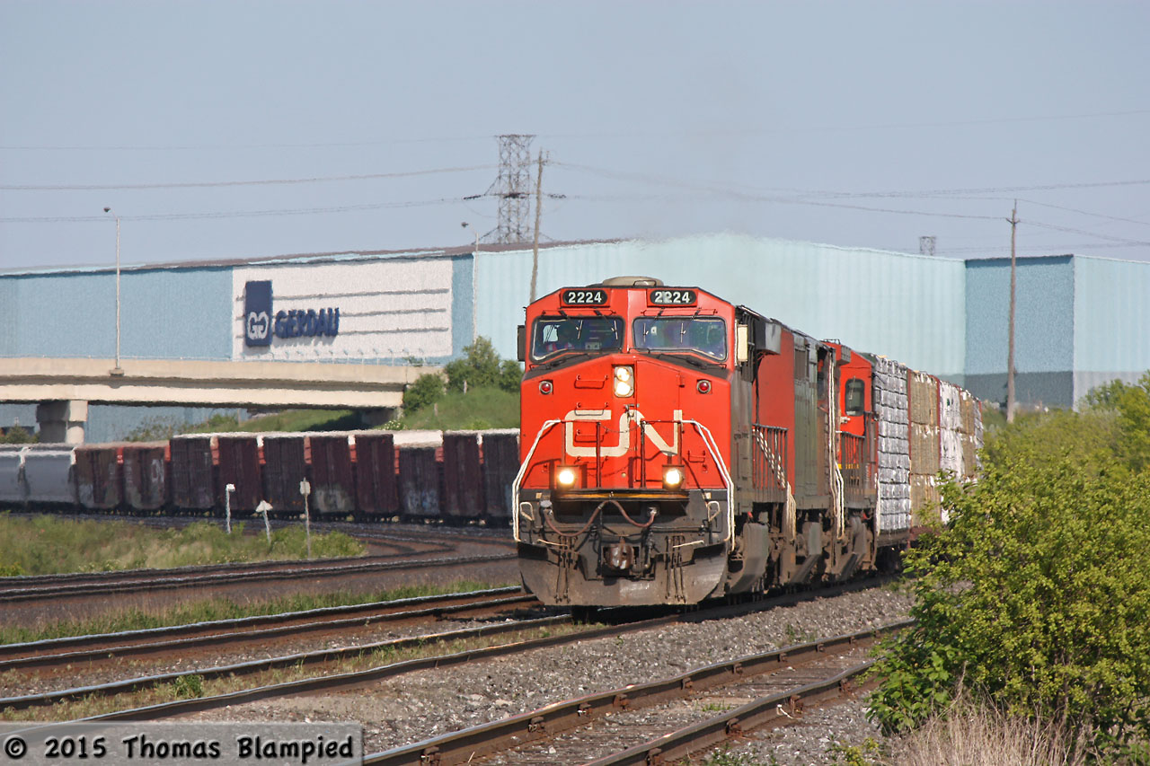 CN 2224 leads 2453 and 2113 round the curve westbound at Whitby.