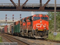 The ripples betray the heat of a summer afternoon as CN 2308 leads 8825 and 2243 elephant-style through Oshawa.