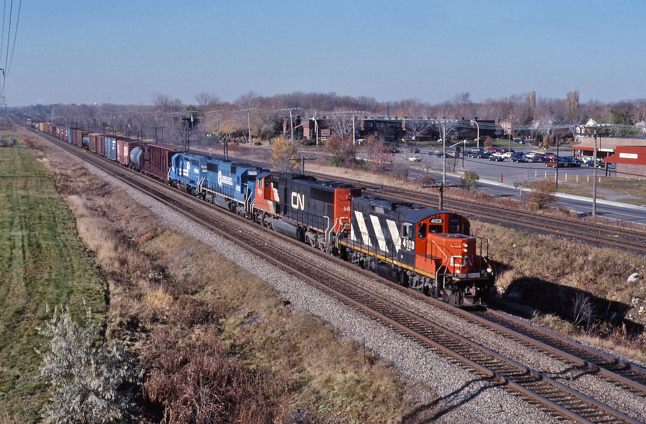 CN 327 cruises east to Montreal with CN 4103, CN 5654, CR 6752, CR 6492 providing the power.